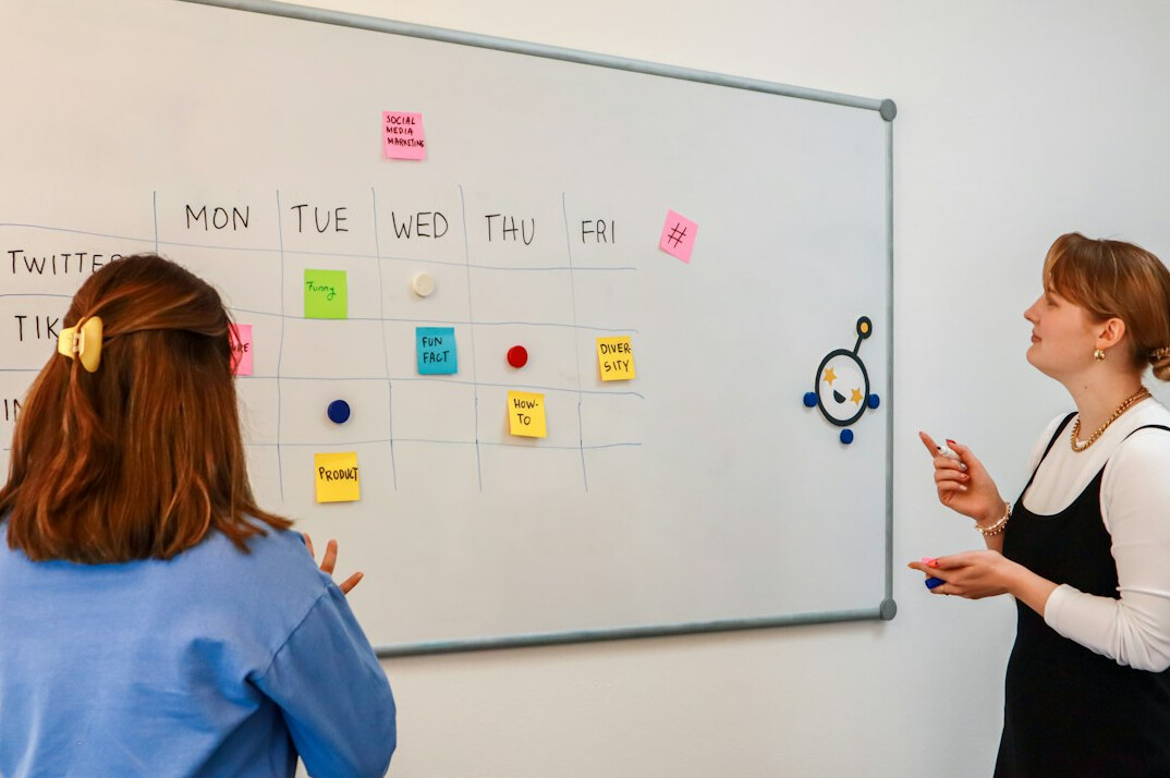 Business team meeting around a table discussing a project
