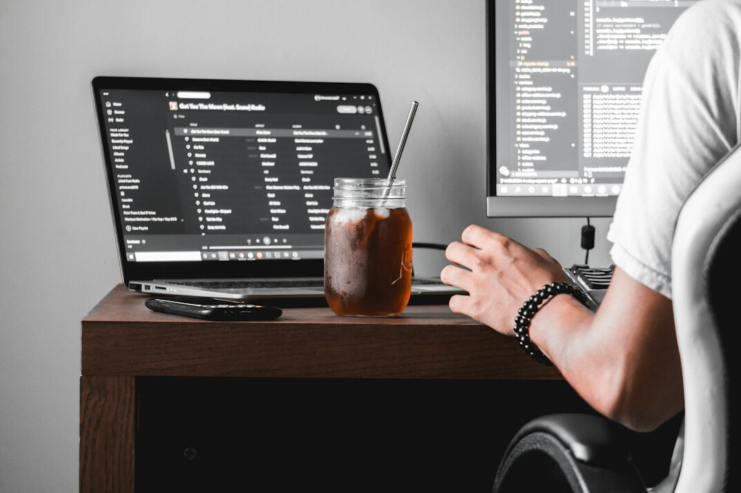 programmer working on laptop